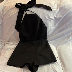 Black cocktail romper with large bow tie